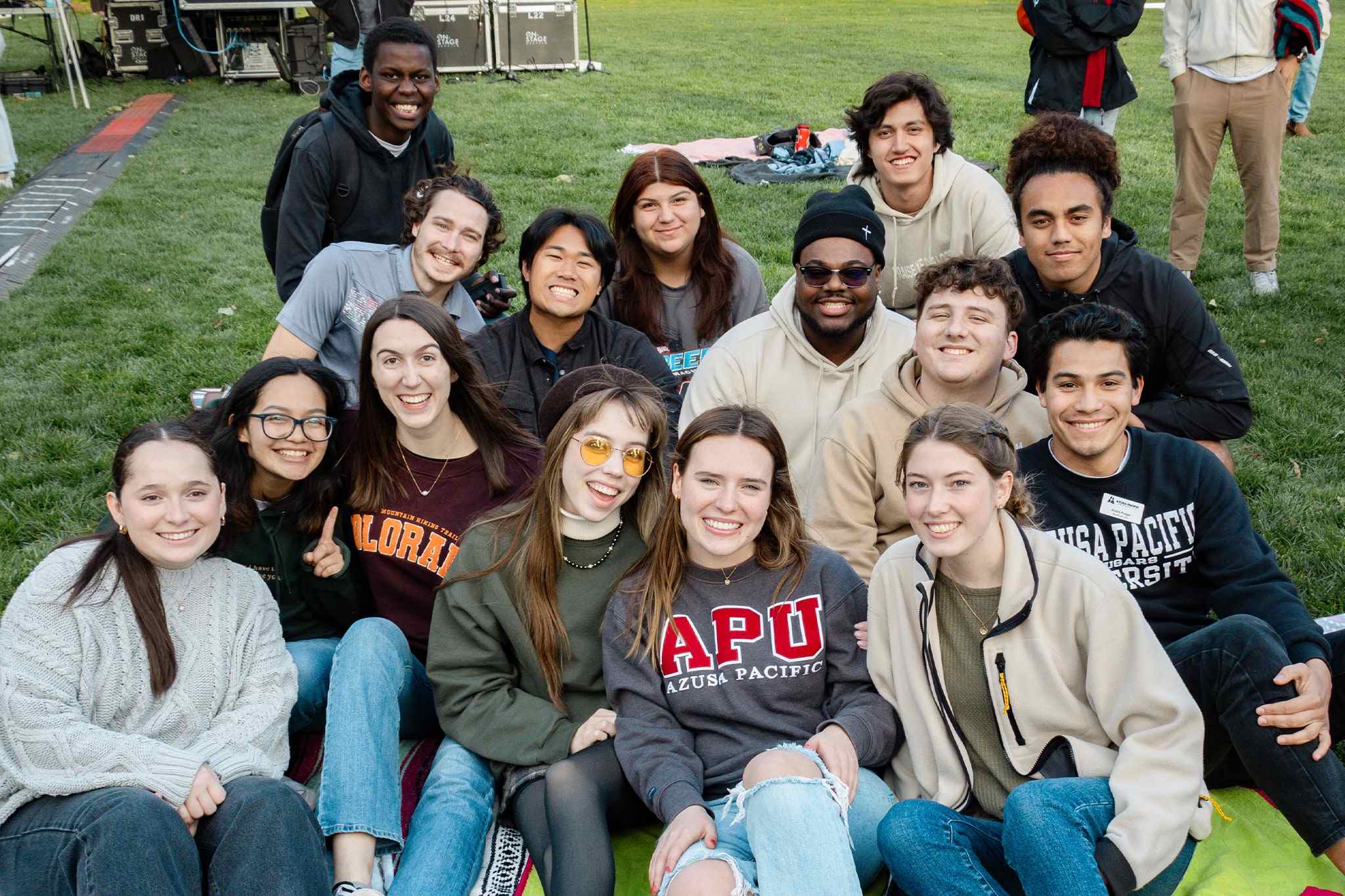 Students smiling on lawn