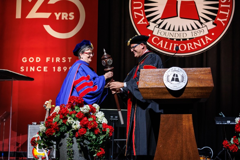 anita receiving the mace from president morris during installation ceremony