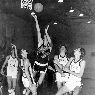 apu basketball playing during a match. Image is in black and white