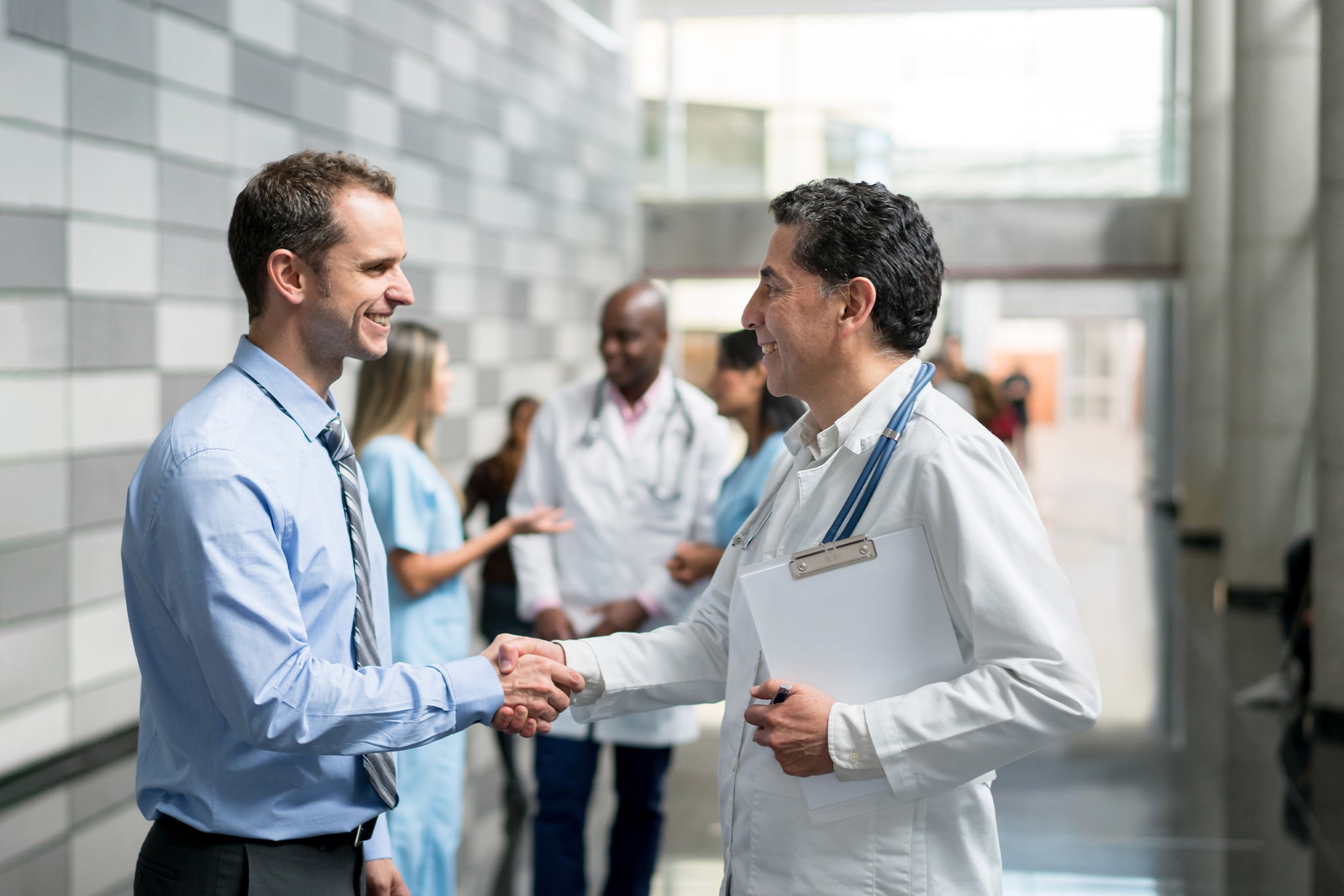 Doctor shaking hands with their colleague
