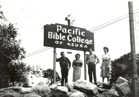 Faculty posing with PBC sign