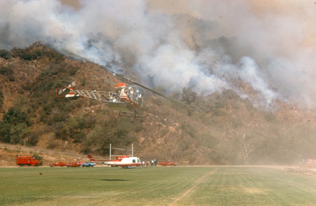 Rescue workers putting out fire