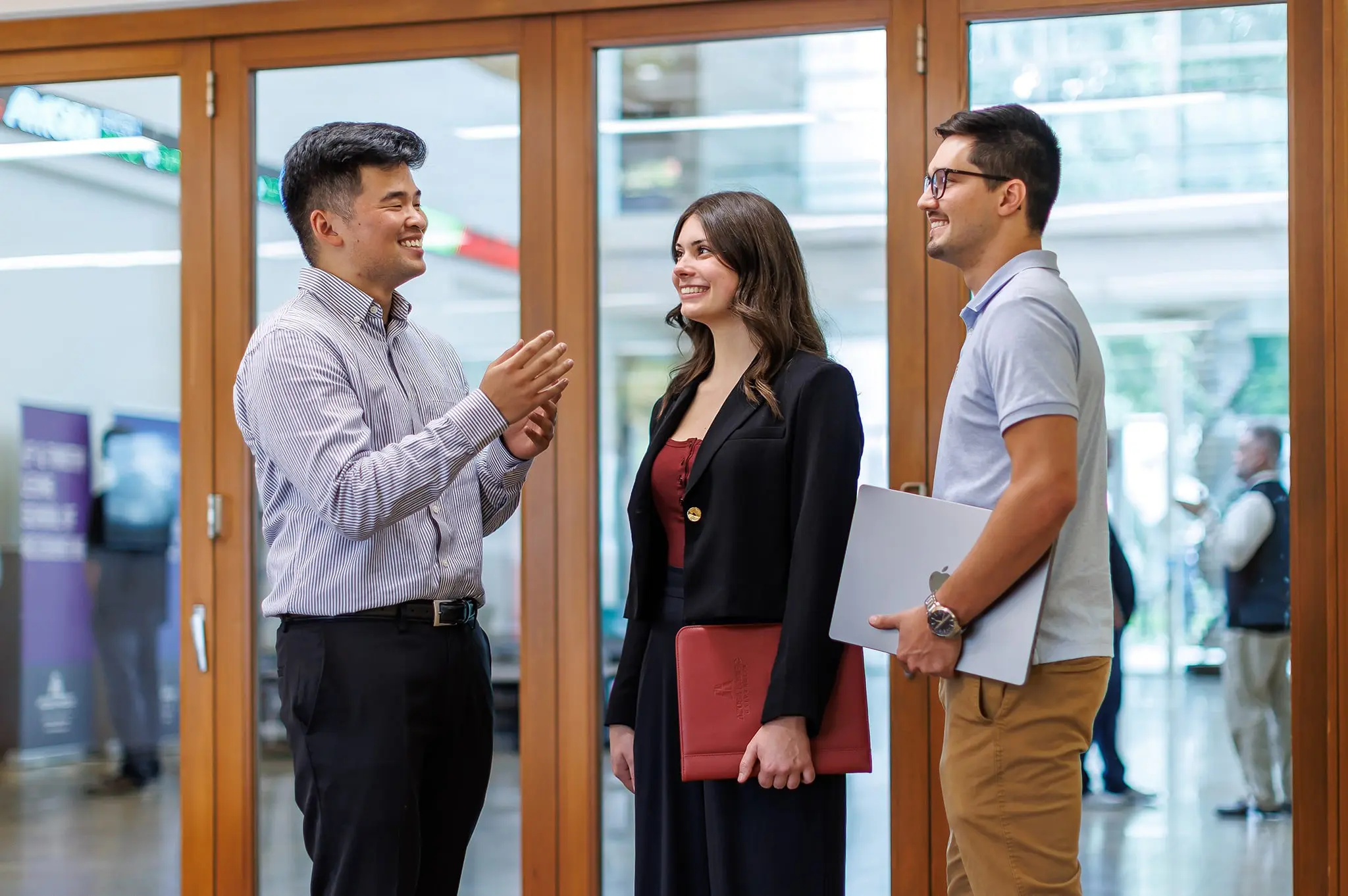 Three professionals chatting
