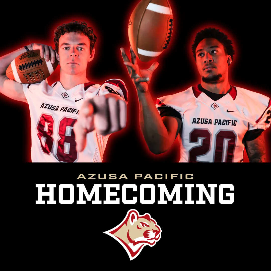 Two APU football players holding a football