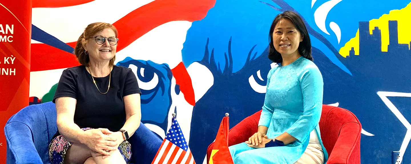 Mary Wong sitting beside Vietnamese lady