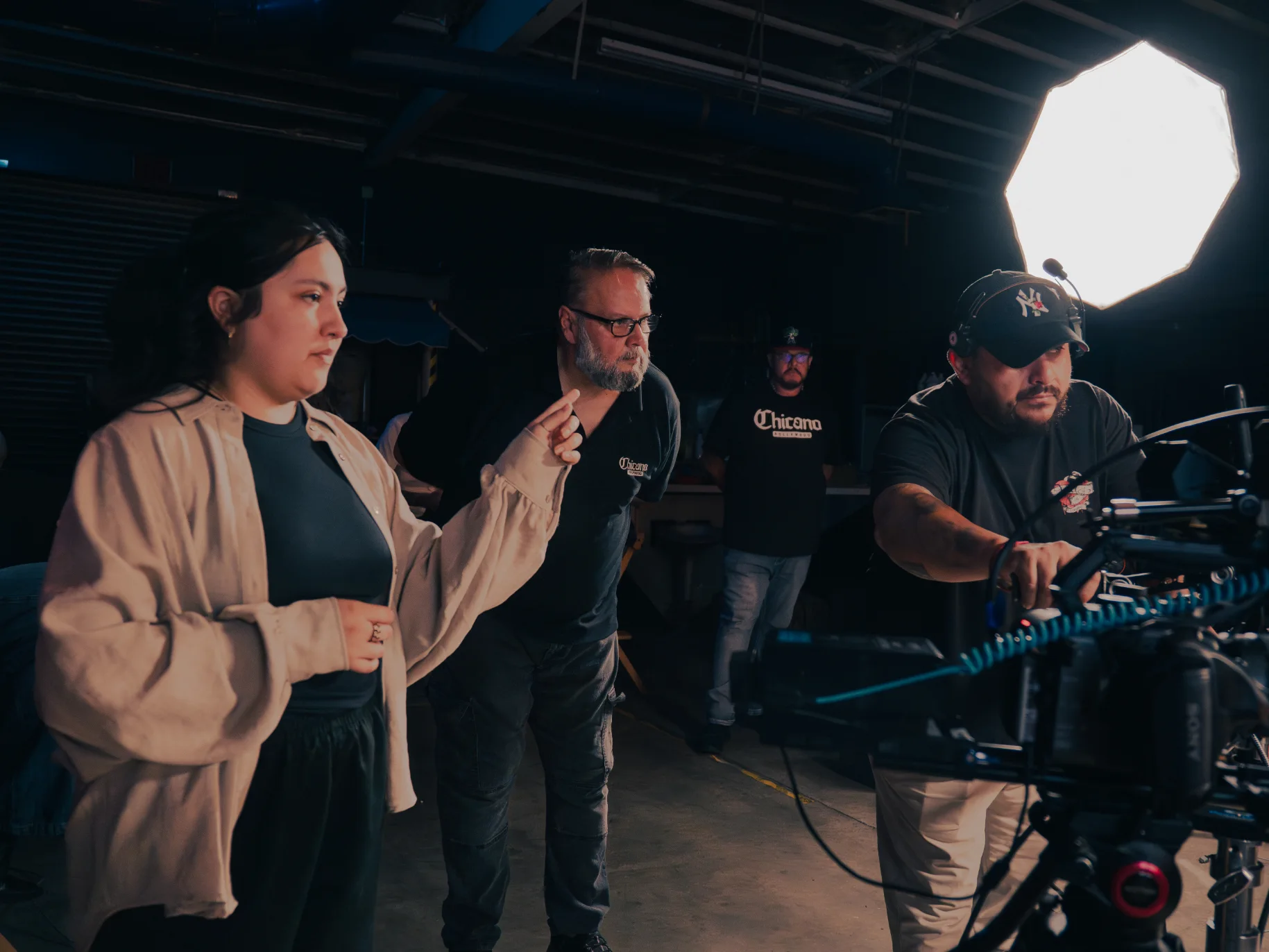 Bethany directs a filming session with Chicano Hollywood coworkers.