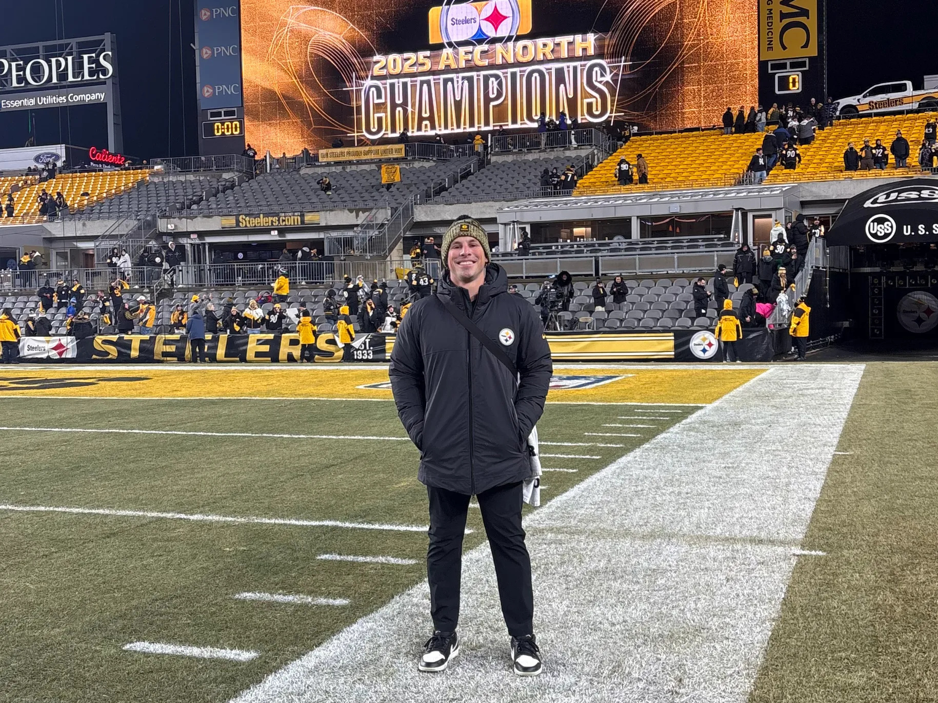 Blaine Aguiar stands on the Steelers Field after a win.