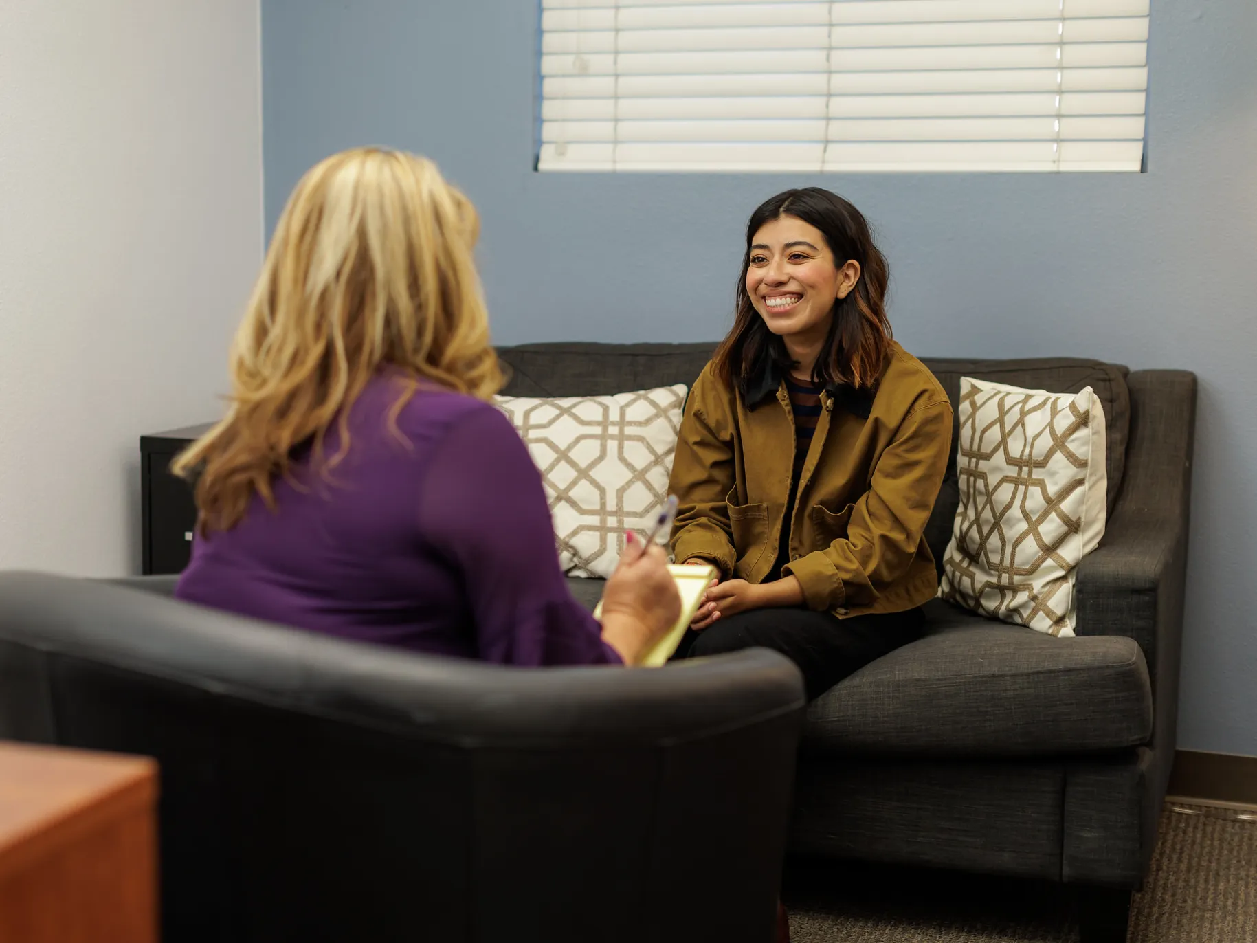 A therapist meets with her patient.