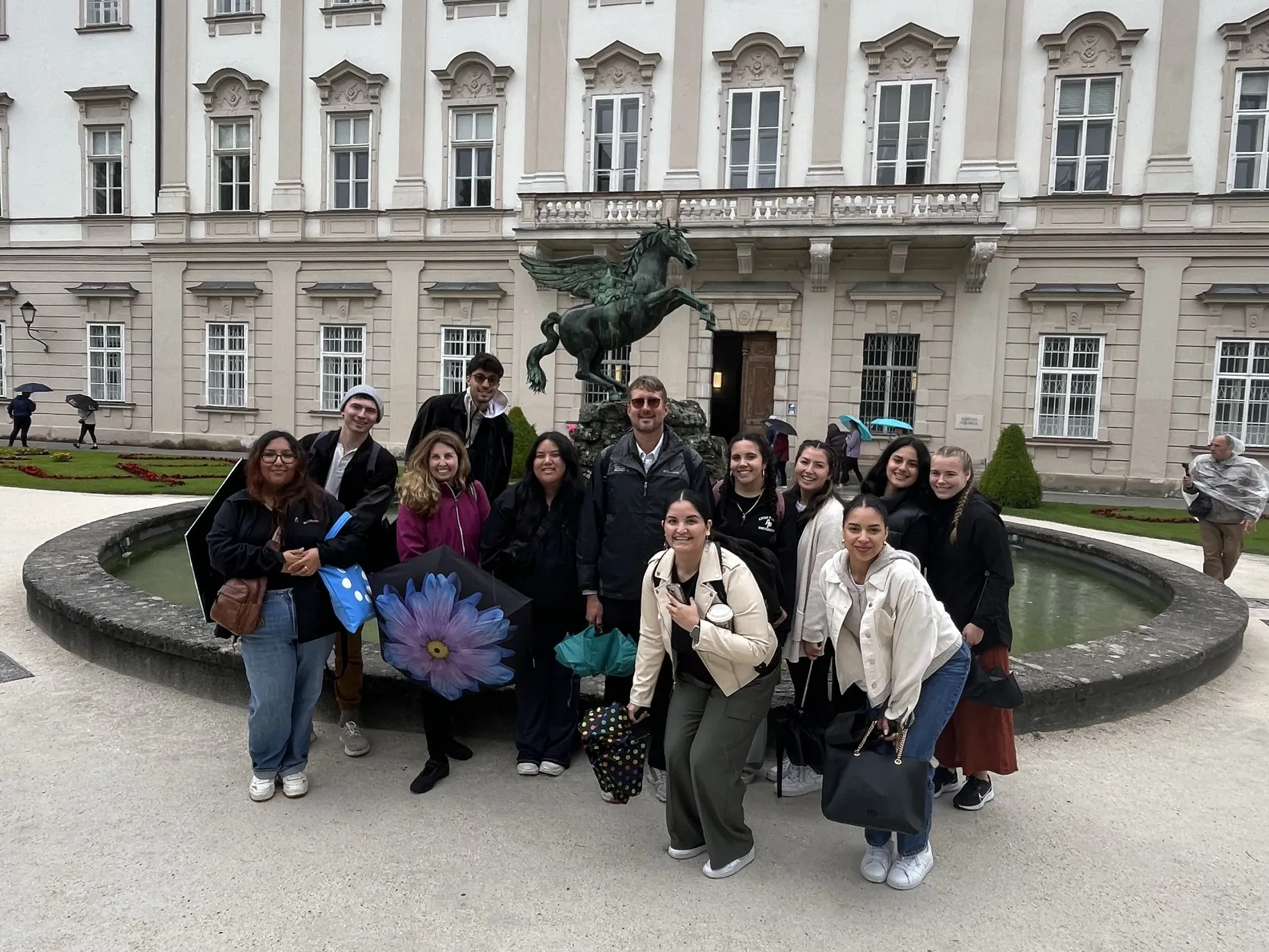 APU students pose in front of a fountain in Salzburg, Austria.