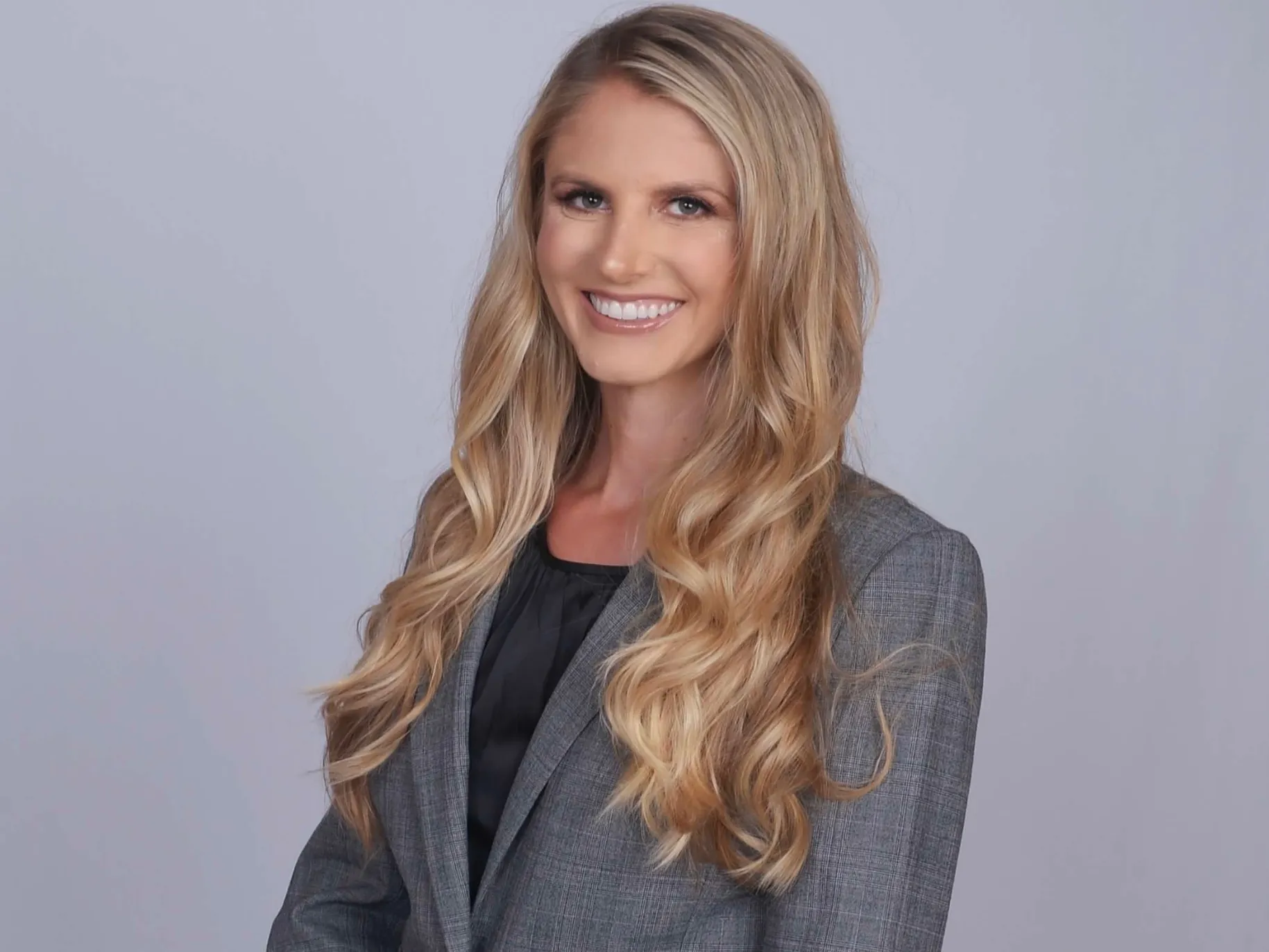 Marissa Brash smiles for a professional photo.
