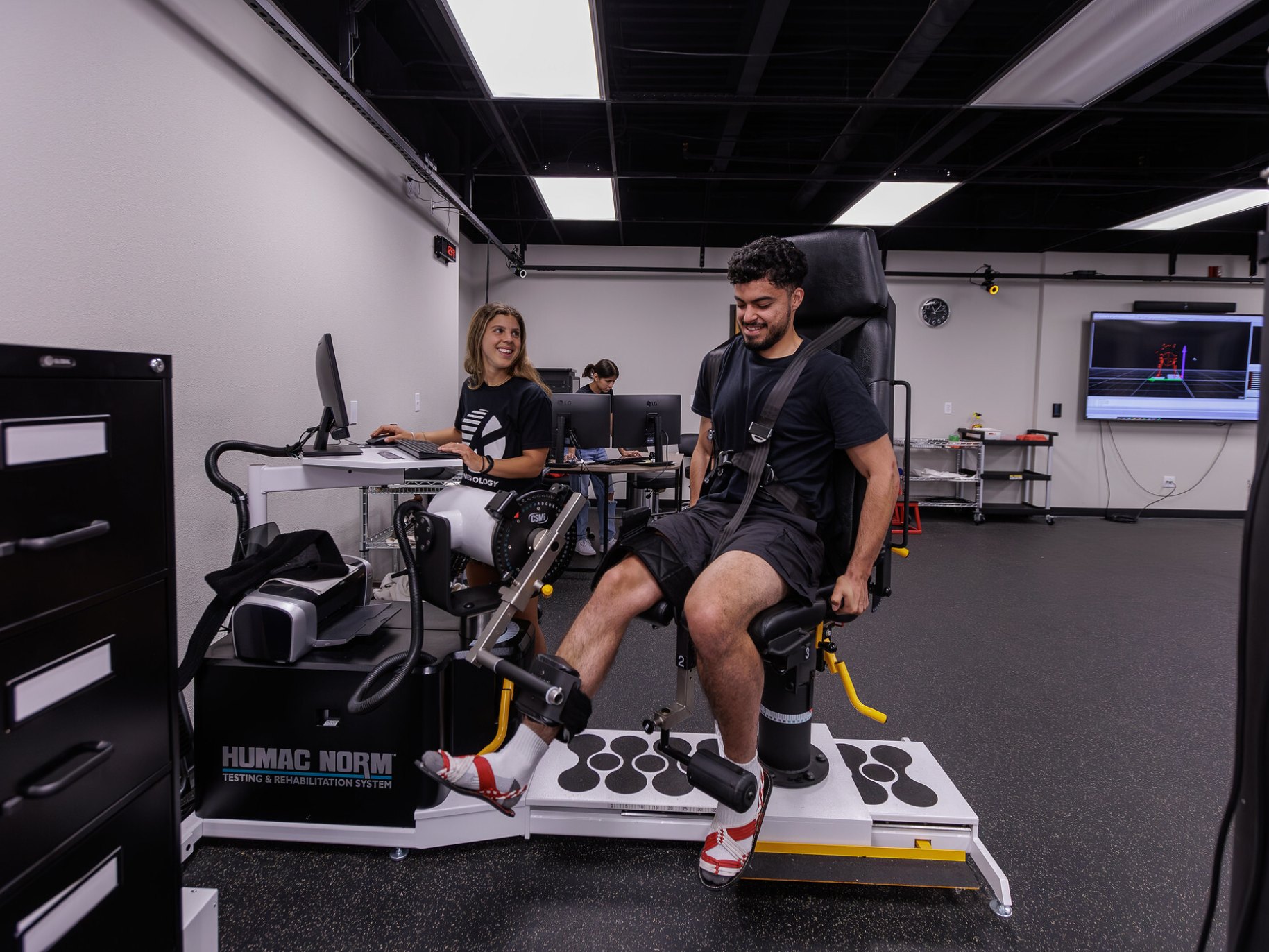 Kinesiology students using technology and testing equipment