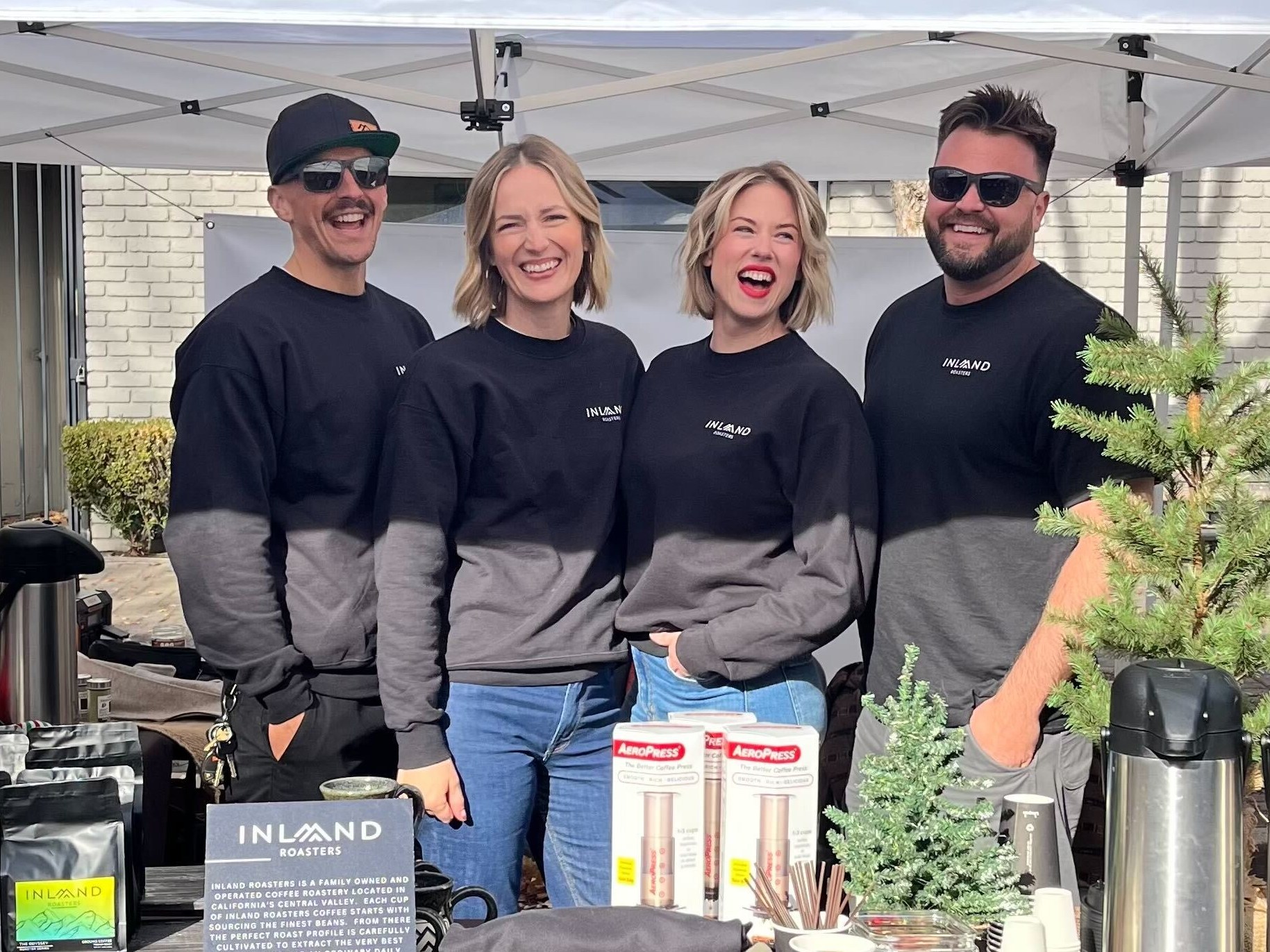 caitling volk smiling with her co-workers