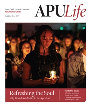 APULIFE front cover of student with a candle