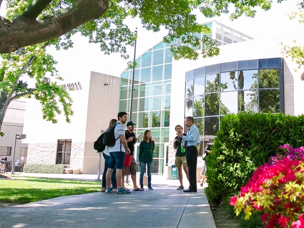 apu staff showing campus to group of students