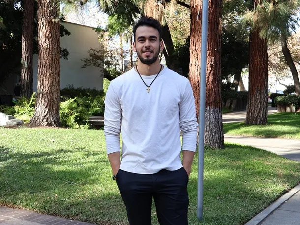 David Saenz wearing white t-shirt and smiling