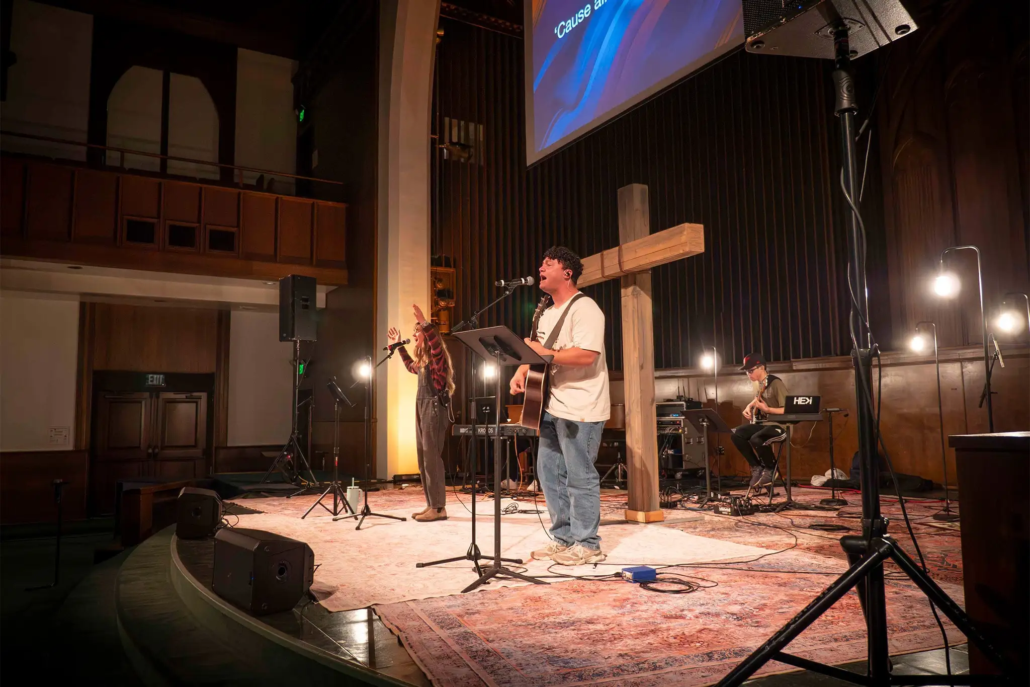 student playing the guitar on stage