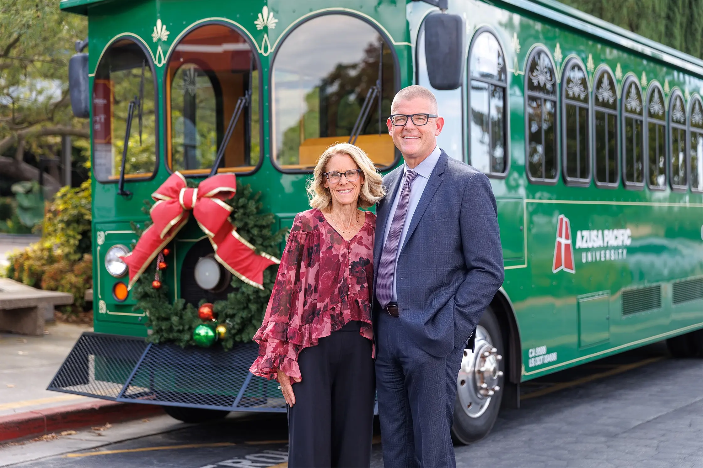 Adam Morris with this wife Faith in front of the green trolley