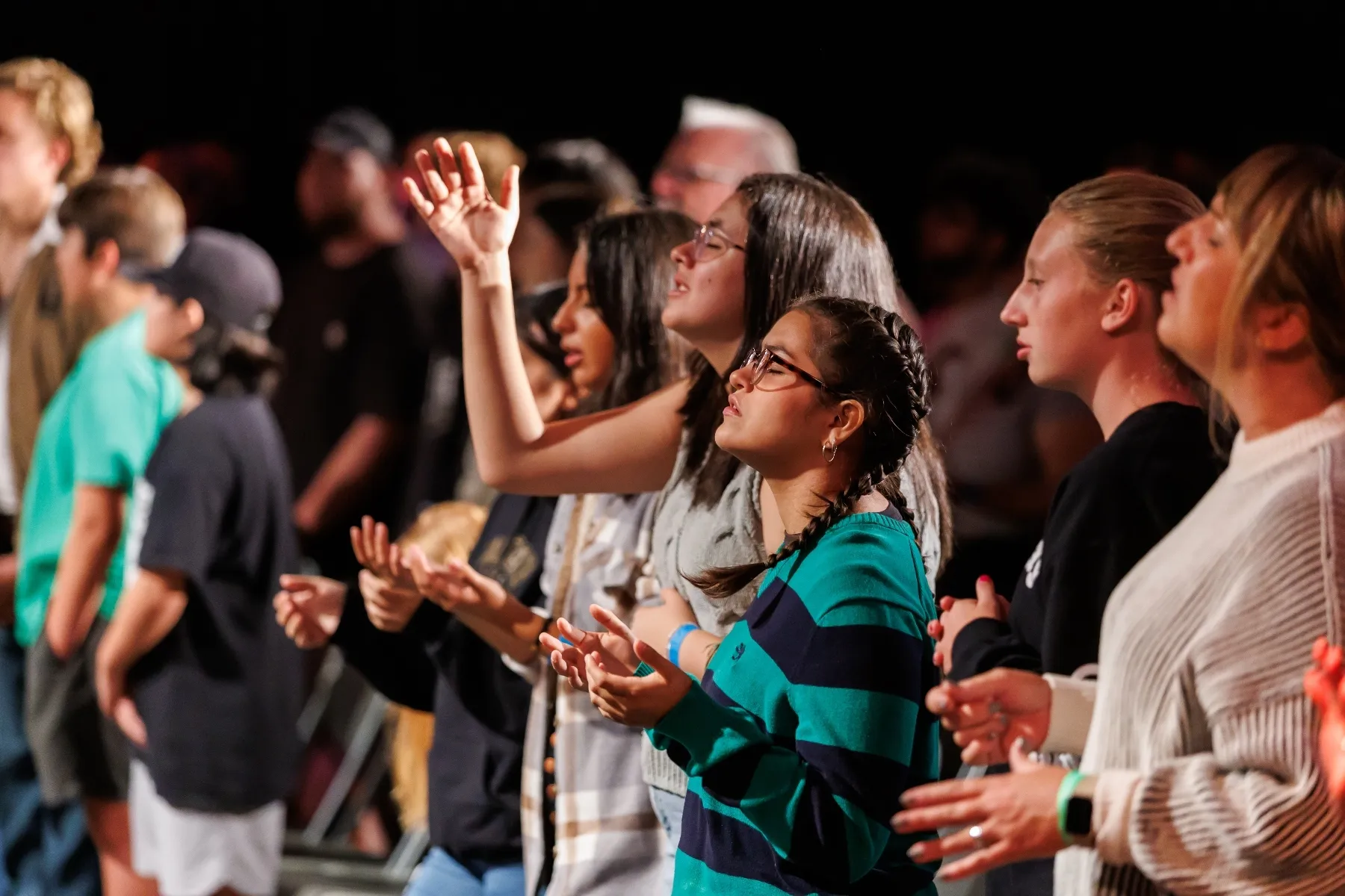 students praying during chapel