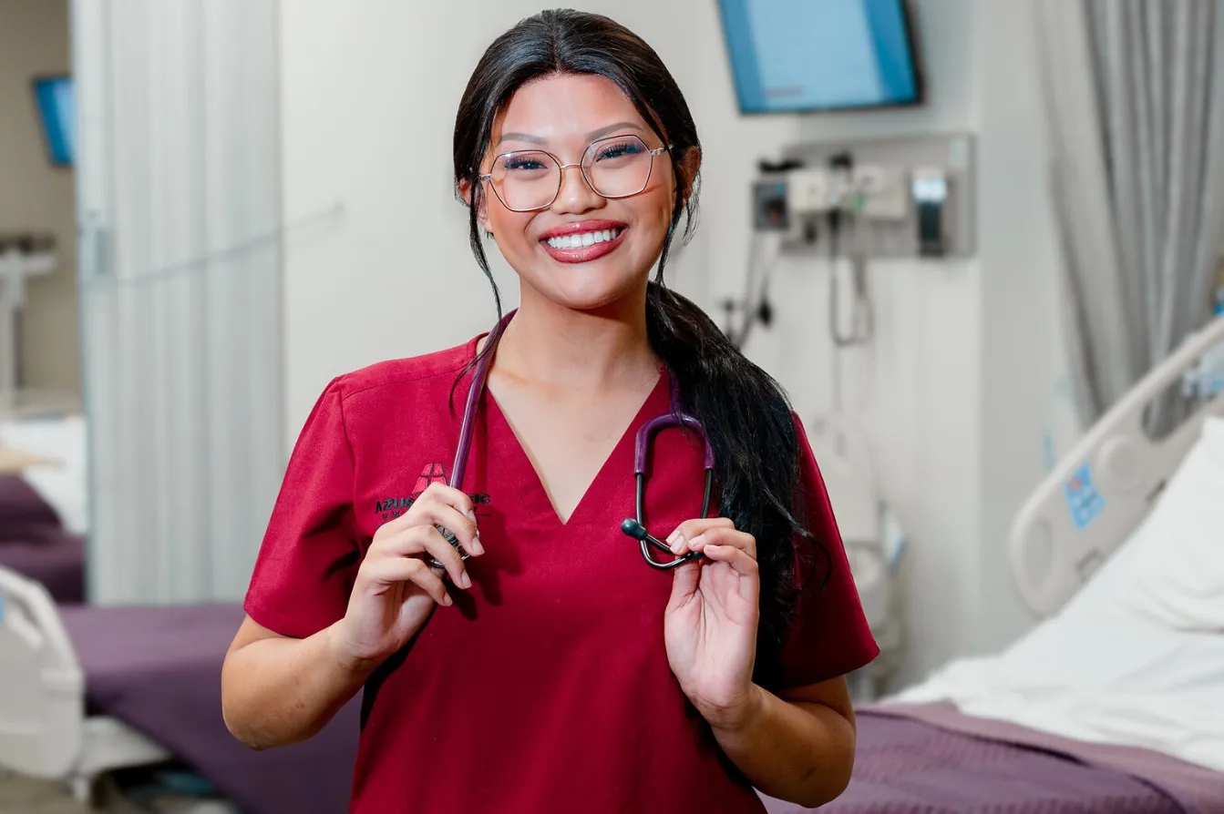 nursing student wearing brick uniform