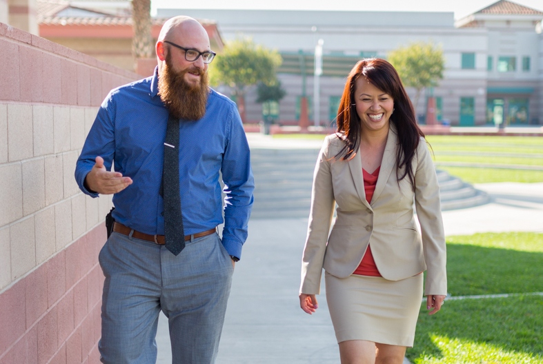 APU graduate Kim Lu Lawe, right, chats with a colleague.