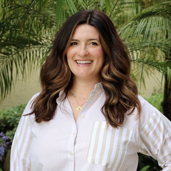 kellie smiling and wearing a white shirt