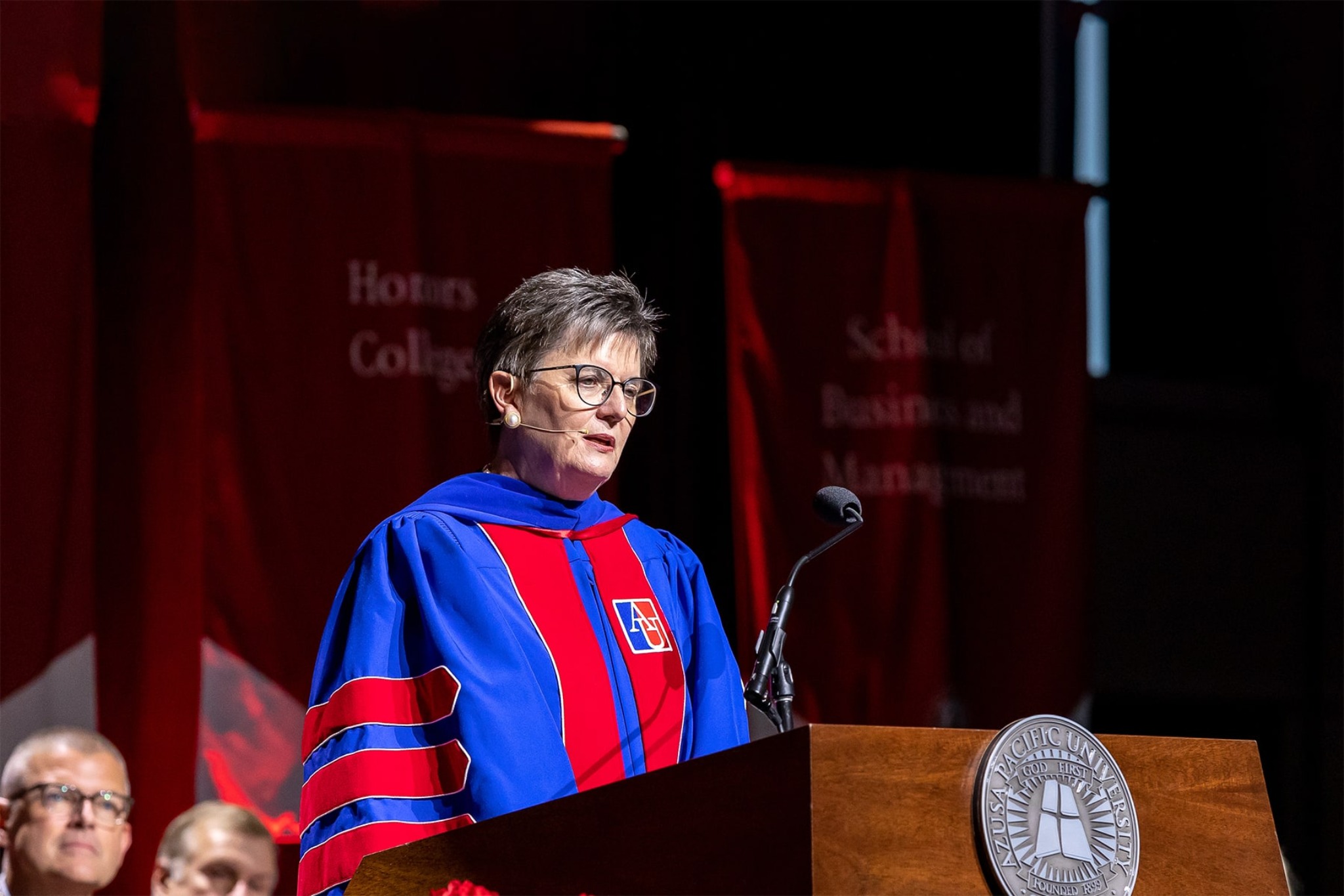 woman wearing an academic regalia during a commencement event
