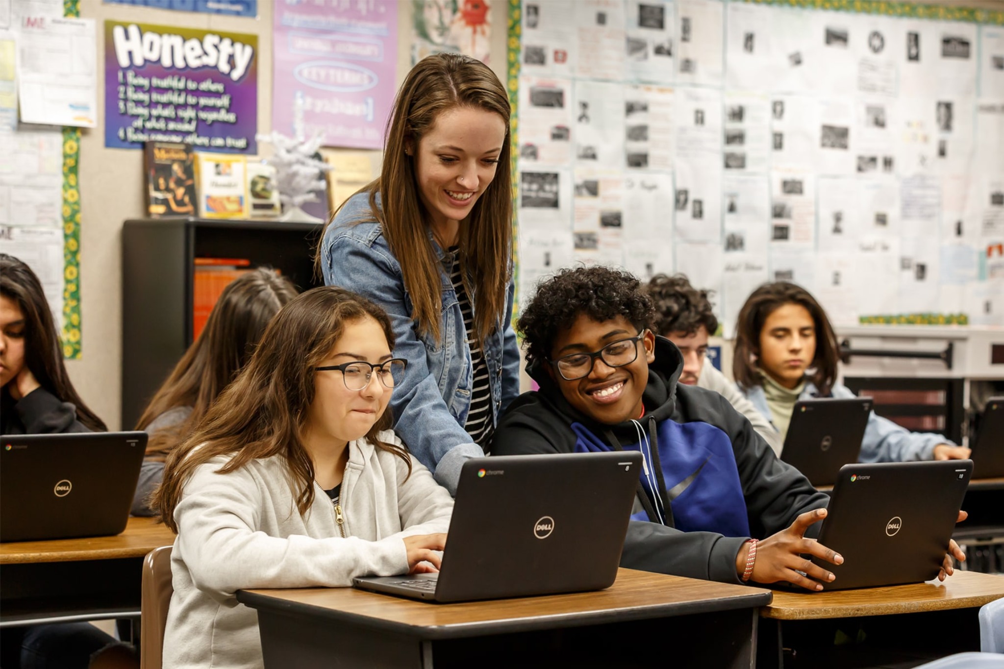 professor guiding students during a class activity