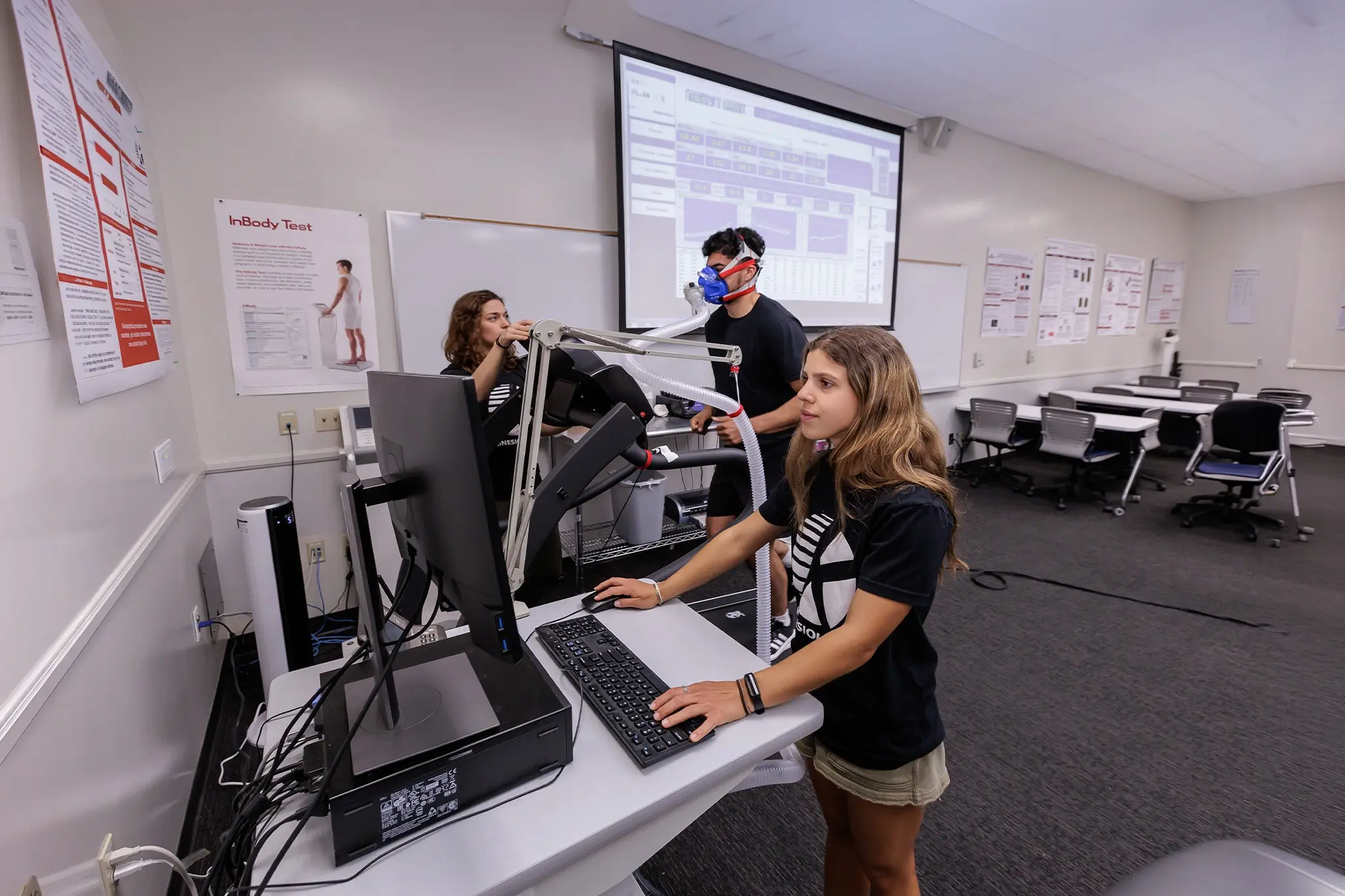 Students in class working on a treadmill