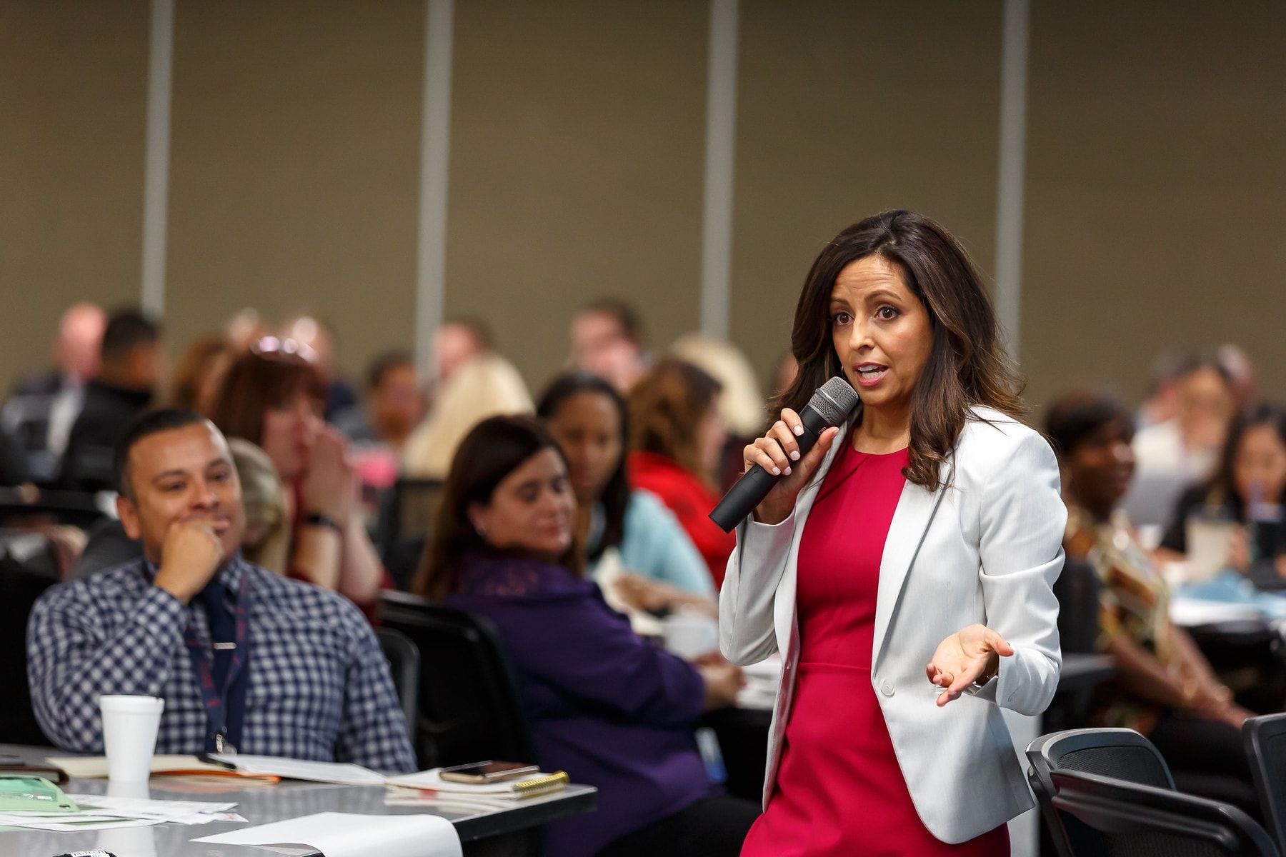 professor talking to students using a microphone