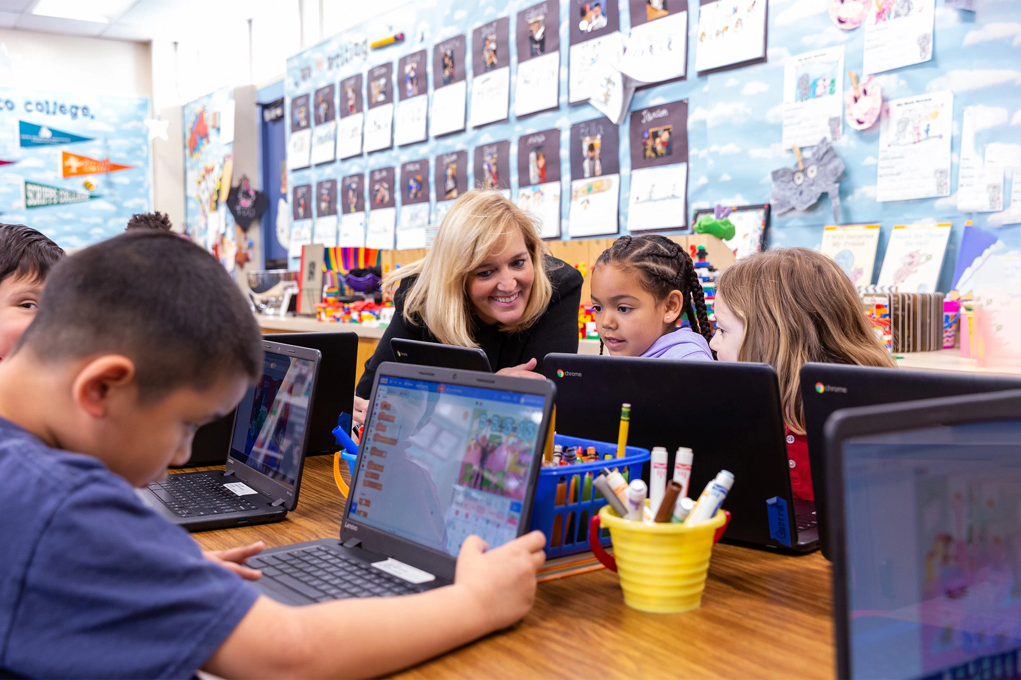 professor guiding students during a class activity