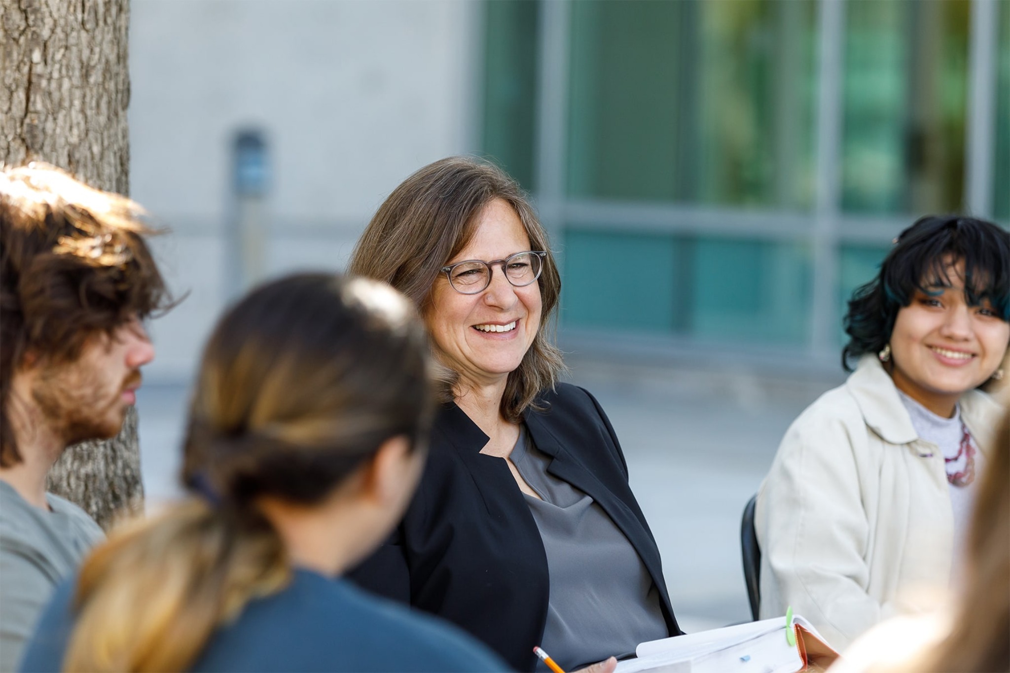 an apu professor smiling during class