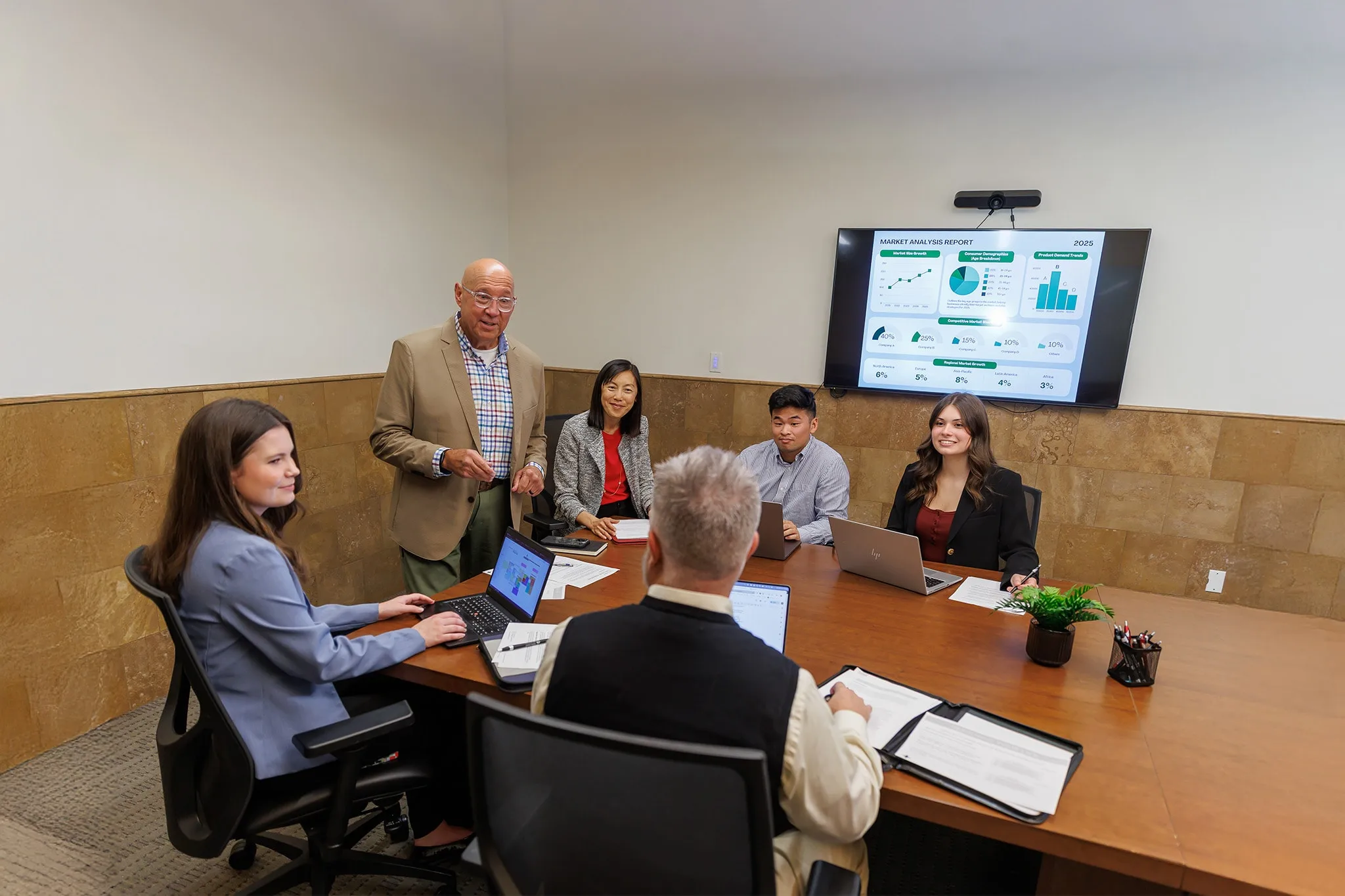 apu's professor explaining something to a group of students in the classroom