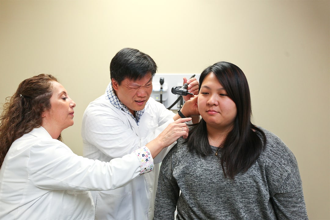 Two nursing students evaluating patient