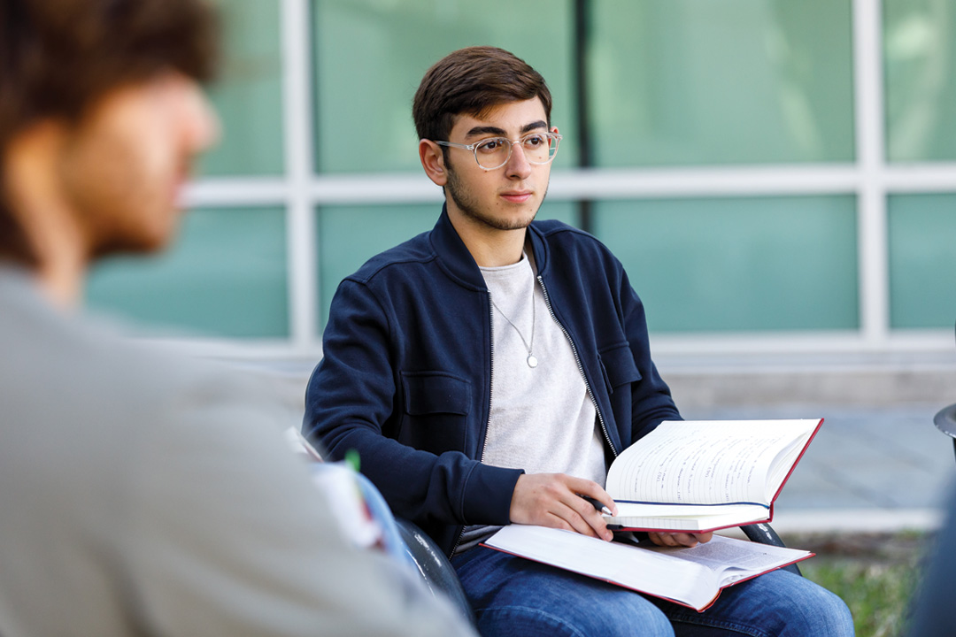 Student with notebook open