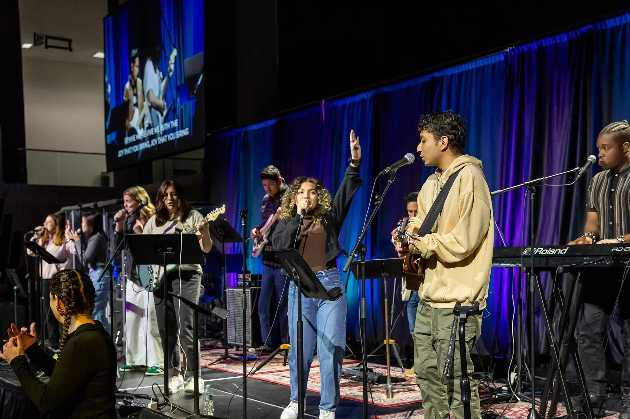 Student worshipping in chapel