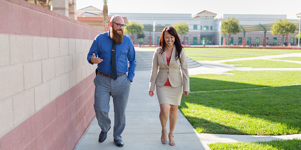 Kim walking with school staff