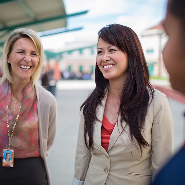 Kim chatting with colleagues