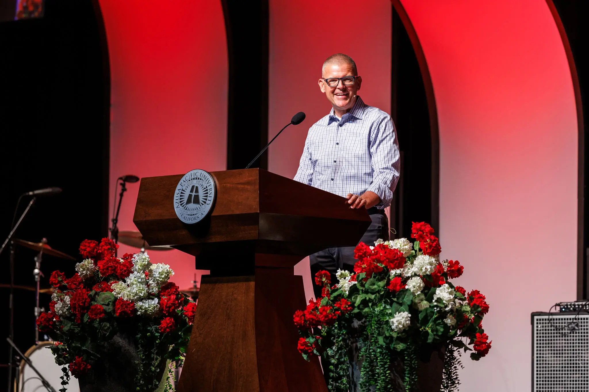 president adam morris speaking to the public during a ceremony