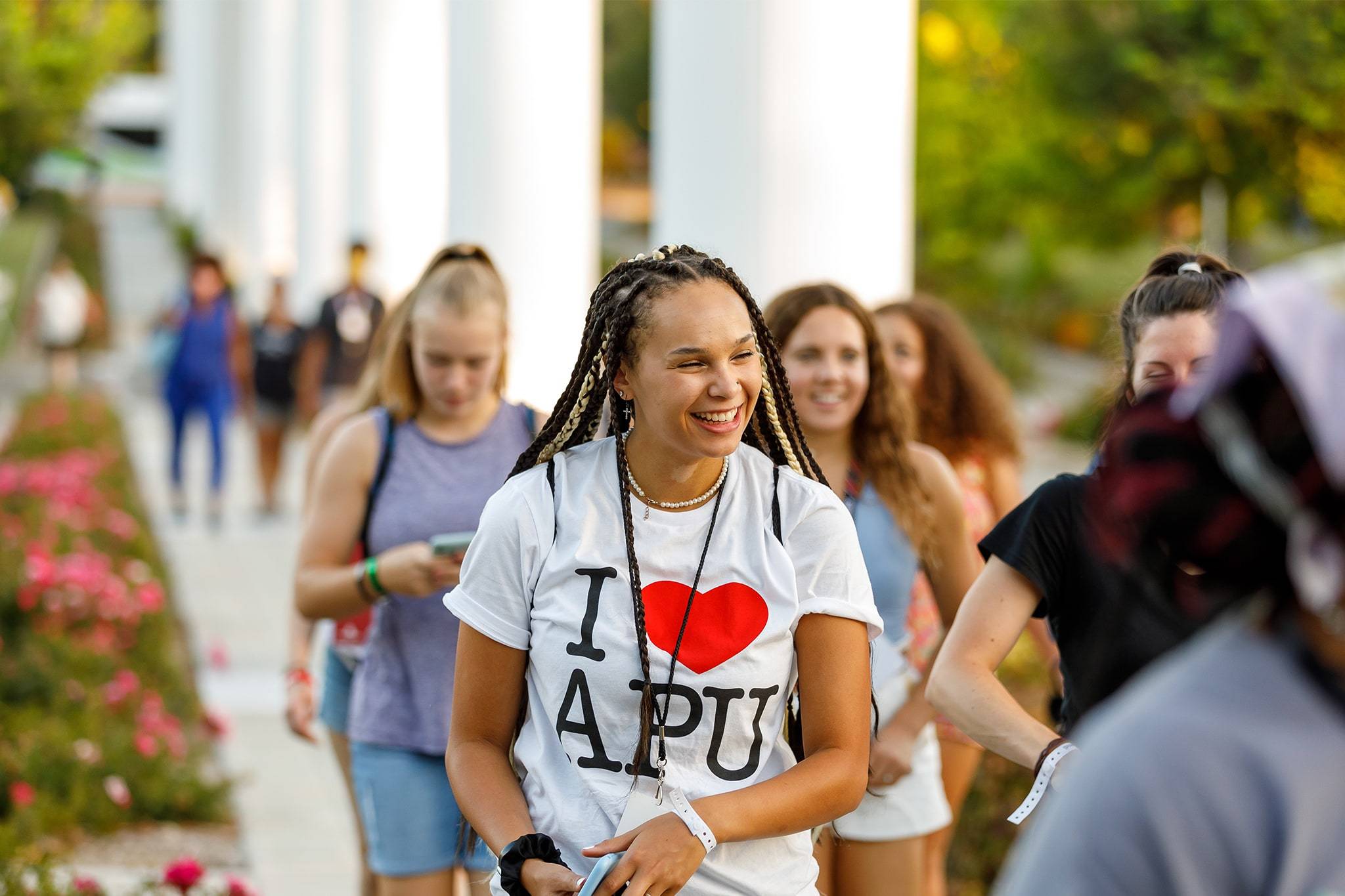 apu’s student walking on west campus