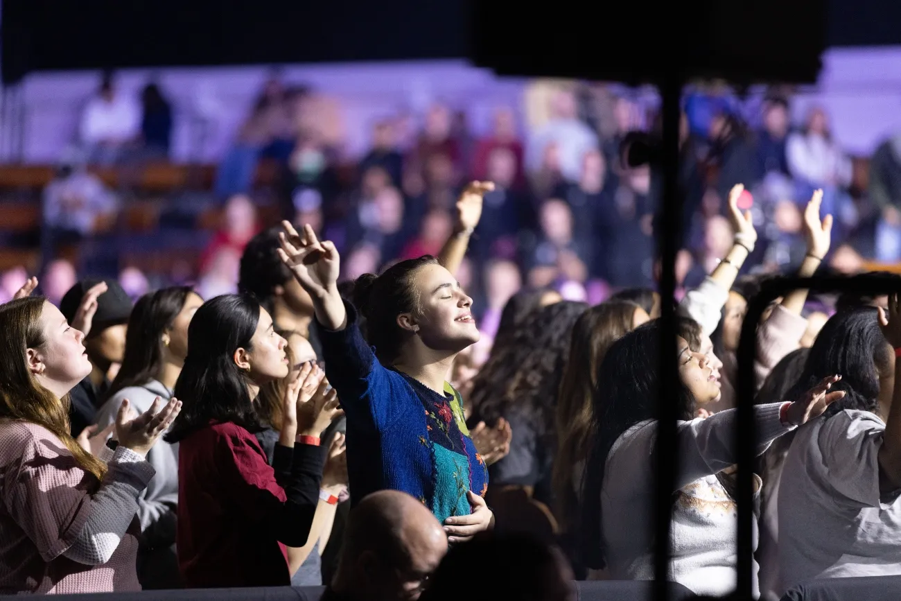 student smiling during concert at apu