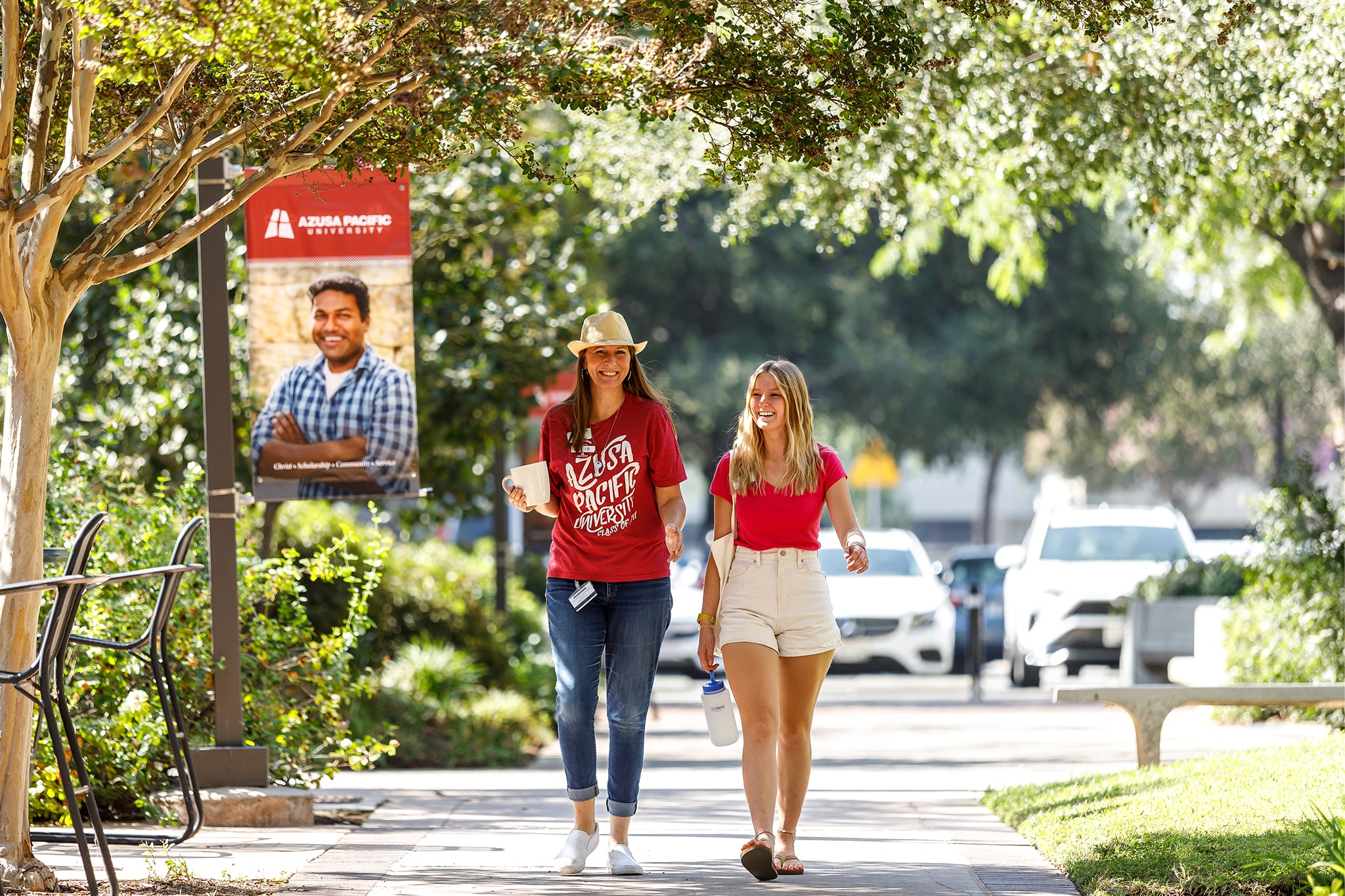 Parent and student strolling on campus