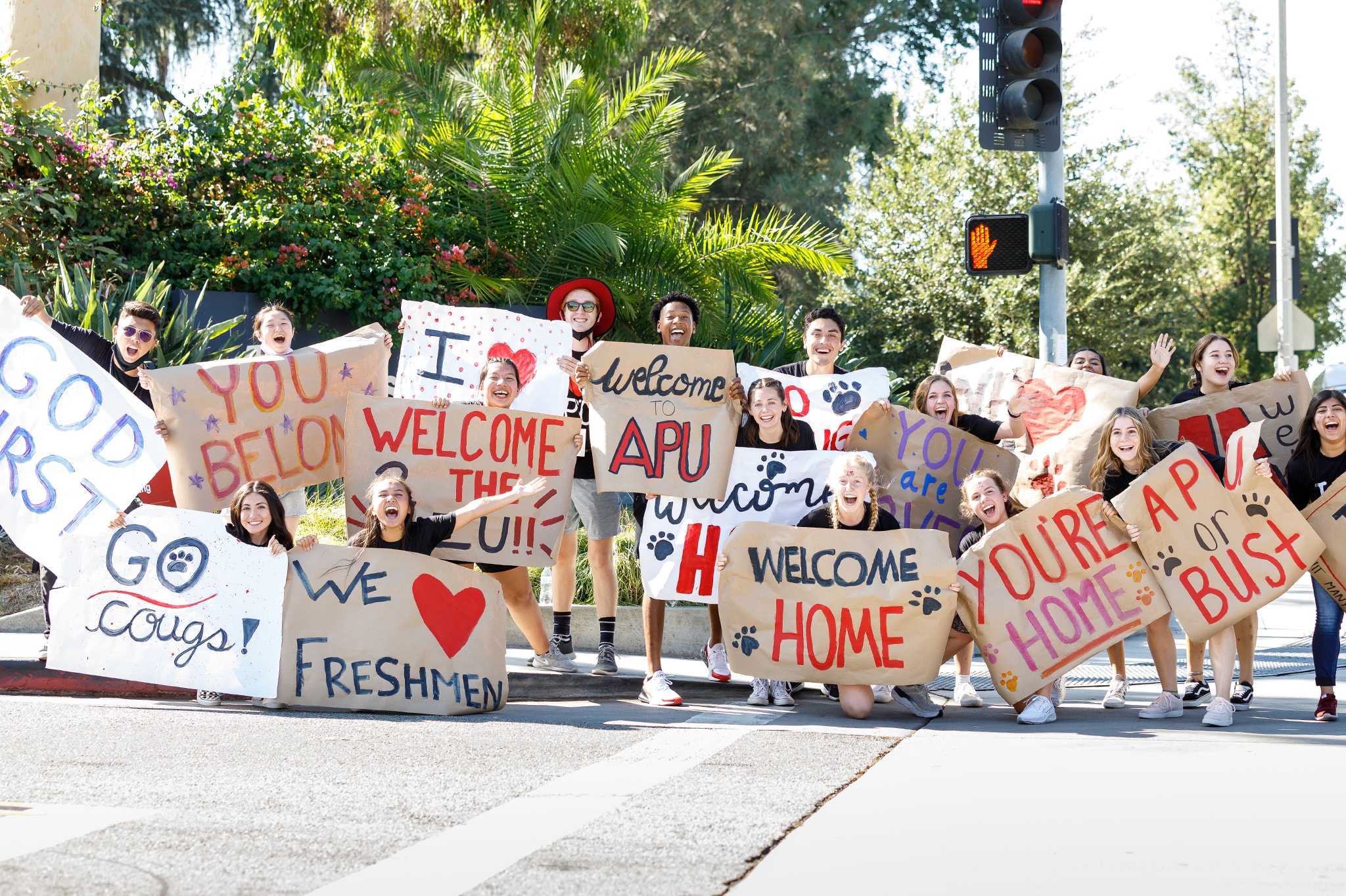 Students holding welcoming posters