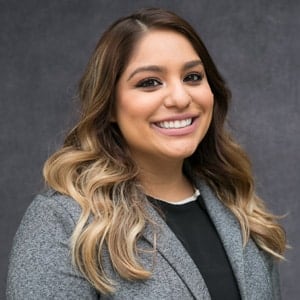 Michelle Stags wearing a grey blazer.