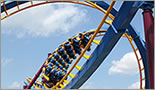 a yellow rollercoaster from magic mountain